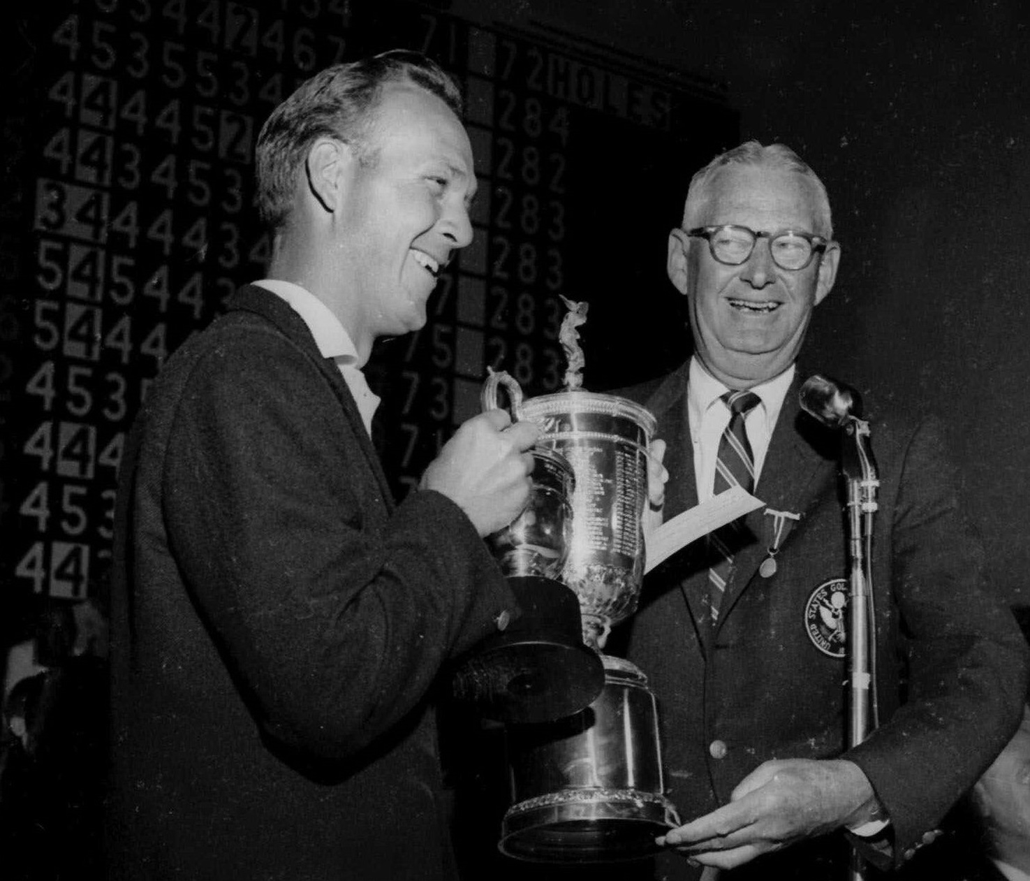 John Clock, president of the USGA, presents the U.S. Open trophy to Arnold Palmer, left, at the Cherry Hills Country Club in Denver in 1960. (Associated Press file)