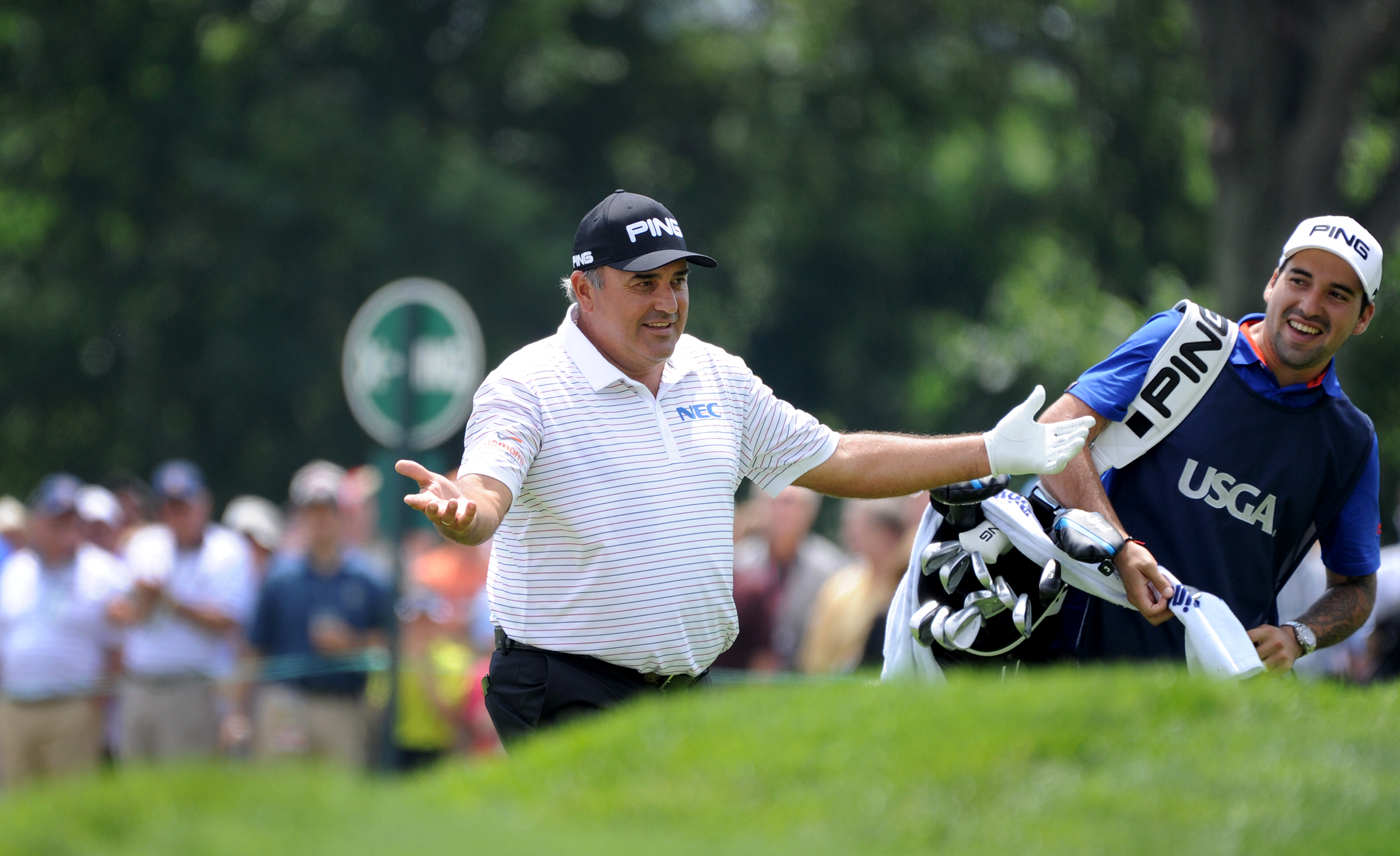 Angel Cabrera welcomes cheers from spectators after hitting a birdie on the 11th hole Friday at Oakmont. (Lake Fong/Post-Gazette)