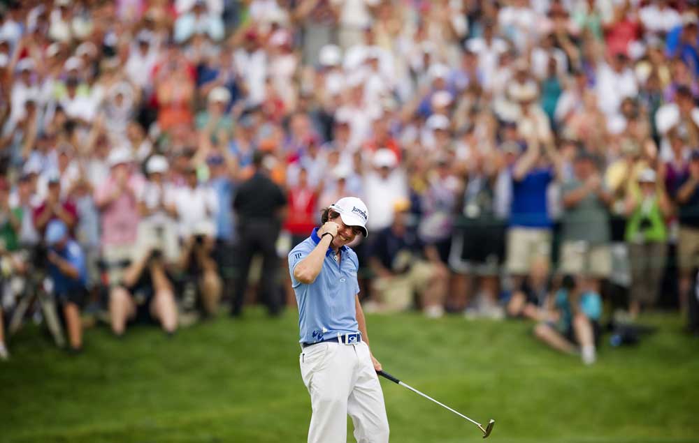 Rory McIlroy celebrates after sinking his final putt to win the 2011 U.S. Open at Congressional only two months after his collapse in the final round of the Masters. (Jim Watson/AFP/Getty Images)