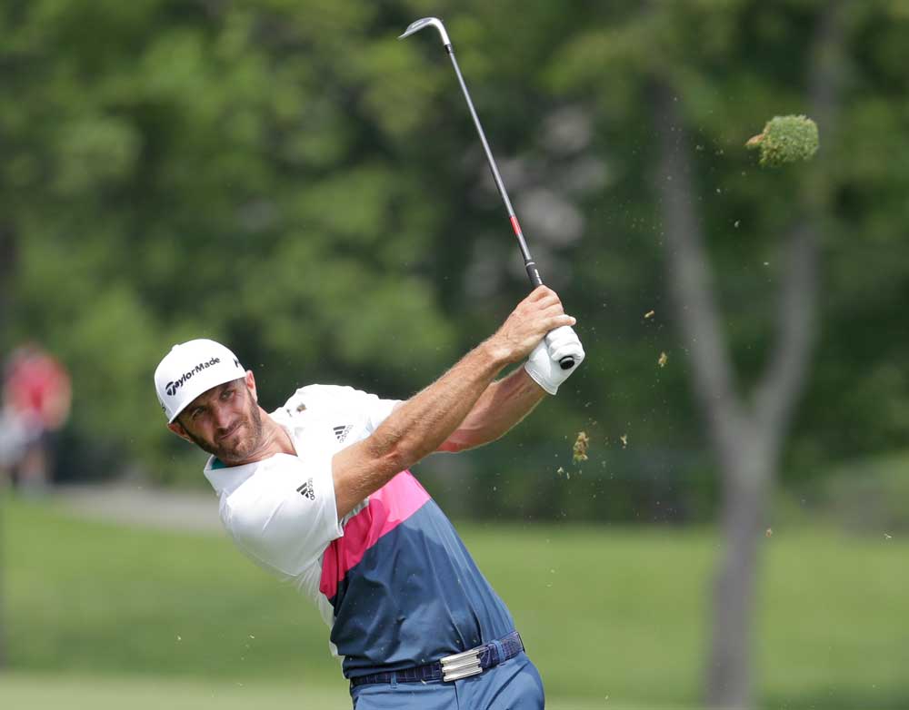 Dustin Johnson hits his second shot on the 14th hole during the first round of The Memorial Tournament on June 2 at Muirfield Village Golf Club in Dubln, Ohio. (Andy Lyons/Getty Images)