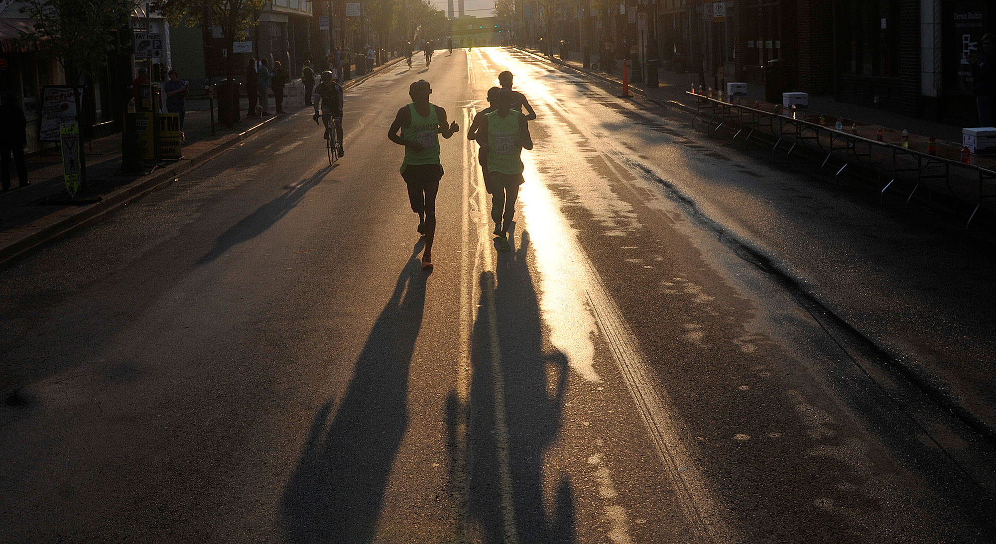 Lead runners in the half-marathon race through the North Side.  (Larry Roberts/Post-Gazette)