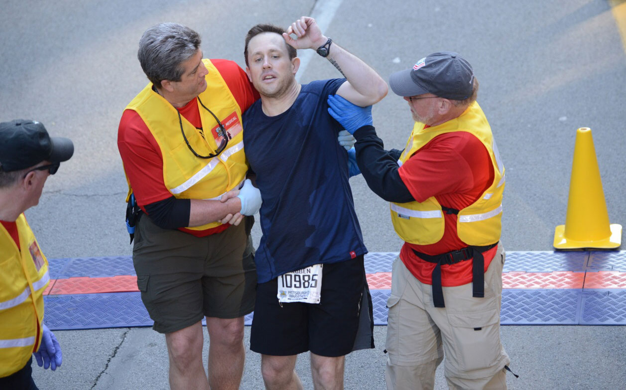 Runner in distress at the end of the race.  (Bob Donaldson/Post-Gazette) 