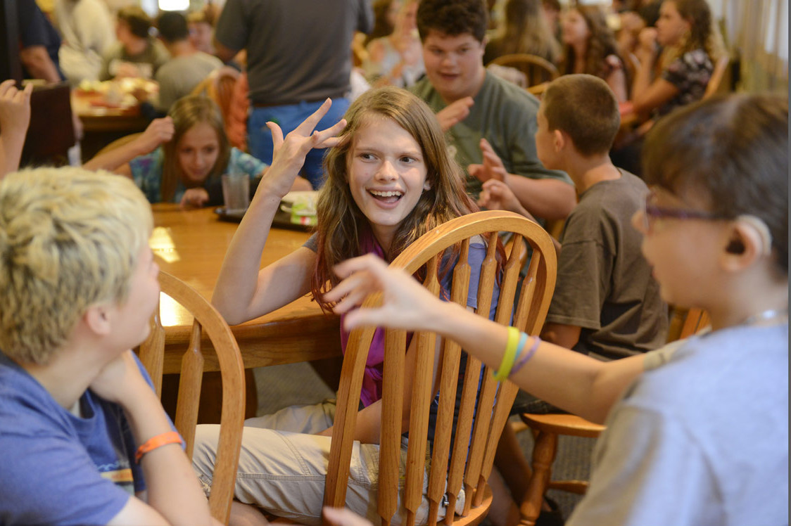 From left, middle school students Dani Fisher, Olivia Larson and Ayesha Austin joke around after lunch at the Western Pennsylvania School for the Deaf in Edgewood on Aug. 24, 2015. (Rebecca Droke/Post-Gazette)